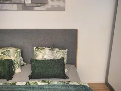 Ein Bett oder Betten in einem Zimmer der Unterkunft am See 5min nach Spiez 20min nach Interlaken