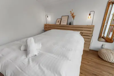 Ein Bett oder Betten in einem Zimmer der Unterkunft Magnifique appartement central à Loèche-les-Bains