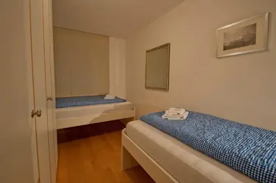 Ein Bett oder Betten in einem Zimmer der Unterkunft Apartment Lora, La Villa Emeline