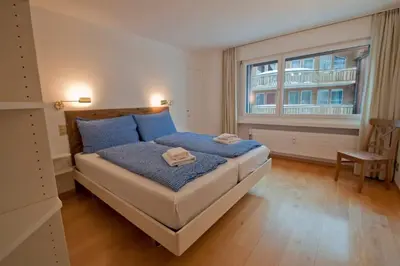 Ein Bett oder Betten in einem Zimmer der Unterkunft Apartment Lora, La Villa Emeline