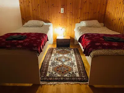 Ein Bett oder Betten in einem Zimmer der Unterkunft 5 Zimmer-Wohnung mit Garage und Sauna