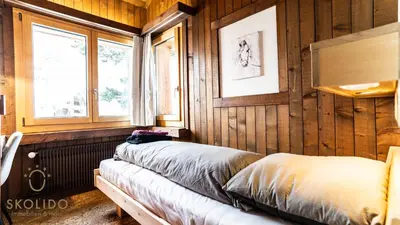 Ein Bett oder Betten in einem Zimmer der Unterkunft Ferienwohnungen Haus Butterfly, Saas-Fee