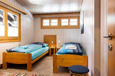 Ein Bett oder Betten in einem Zimmer der Unterkunft Apartment Chalet Diana
