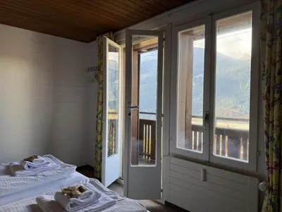 Ein Bett oder Betten in einem Zimmer der Unterkunft Chalet Schweizerhof 4