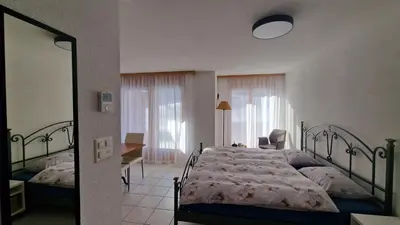 Ein Bett oder Betten in einem Zimmer der Unterkunft An der Langlaufloipe - Studio Arnica