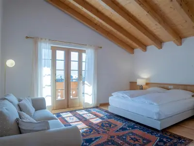 Ein Bett oder Betten in einem Zimmer der Unterkunft Orion - Luxuriöse Duplex Wohnung in Grindelwald