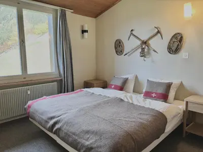 Ein Bett oder Betten in einem Zimmer der Unterkunft Jungfraujoch, Chalet Ski In&Out, Wengen, Valley view