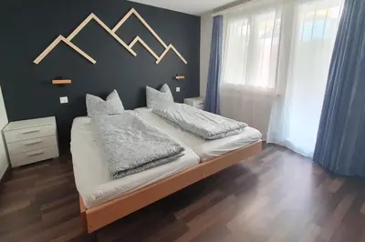 Ein Bett oder Betten in einem Zimmer der Unterkunft Chalet Lärchenheim, central SaasFee close to AlpinExpress