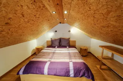 Ein Bett oder Betten in einem Zimmer der Unterkunft Swiss Holiday House