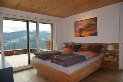 Ein Bett oder Betten in einem Zimmer der Unterkunft Panorama Beatenberg