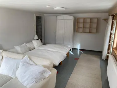 Ein Bett oder Betten in einem Zimmer der Unterkunft Chalet Wasserfall 3-Zimmerferienwohnung möbliert