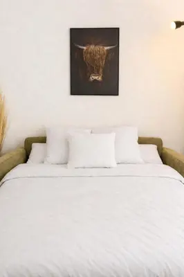 Ein Bett oder Betten in einem Zimmer der Unterkunft Studio au Cœur des Sommets