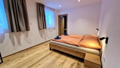 Ein Bett oder Betten in einem Zimmer der Unterkunft Silberdistel Brand-new luxury apartment with private terrace