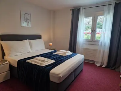 Ein Bett oder Betten in einem Zimmer der Unterkunft Hotel Garni