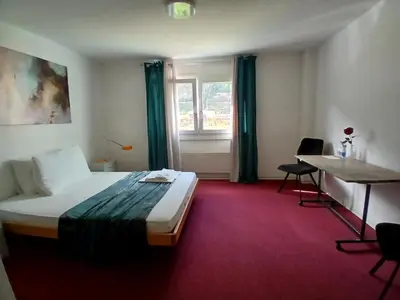 Ein Bett oder Betten in einem Zimmer der Unterkunft Hotel Garni