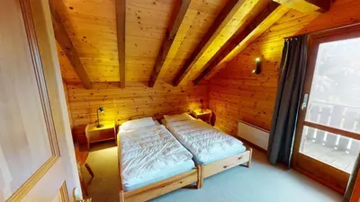 Ein Bett oder Betten in einem Zimmer der Unterkunft Tschuggen TU78