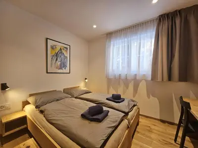 Ein Bett oder Betten in einem Zimmer der Unterkunft Silberdistel EG