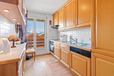 Küche/Küchenzeile in der Unterkunft Magnifique appartement au centre de Crans-Montana