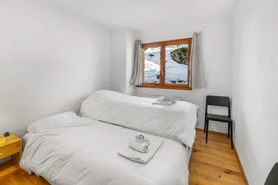 Ein Bett oder Betten in einem Zimmer der Unterkunft Appartement ski aux pieds - domaine des 4 Vallées
