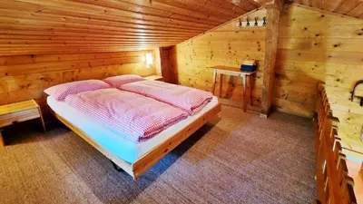 Ein Bett oder Betten in einem Zimmer der Unterkunft Chalet La Sapinière