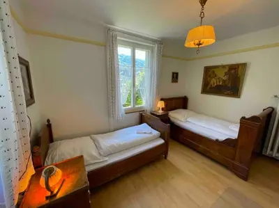 Ein Bett oder Betten in einem Zimmer der Unterkunft Lake Thun Alps Scenic Views and Concierge by SwissHut