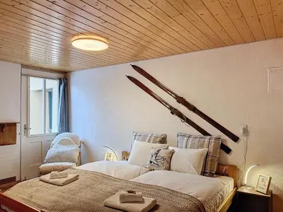 Ein Bett oder Betten in einem Zimmer der Unterkunft Appartement Wengen - Charme Alpin