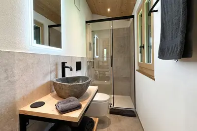 Ein Badezimmer in der Unterkunft Chalet Gletscherliechtli