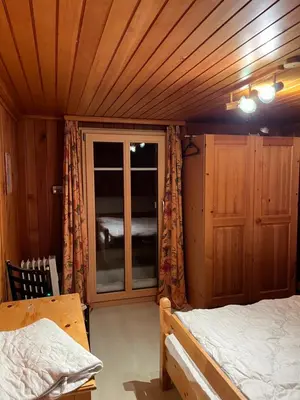 Ein Bett oder Betten in einem Zimmer der Unterkunft Chalet Waldesruh