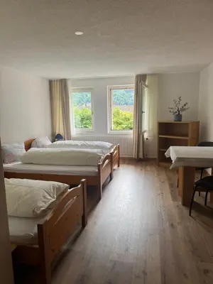 Ein Bett oder Betten in einem Zimmer der Unterkunft Hotel ilufa