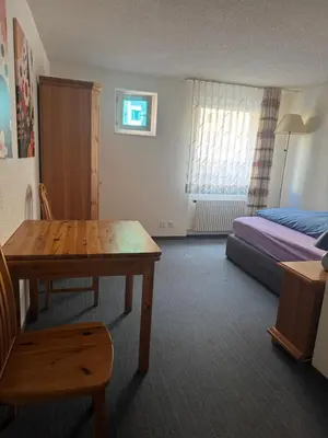 Ein Bett oder Betten in einem Zimmer der Unterkunft Hotel ilufa