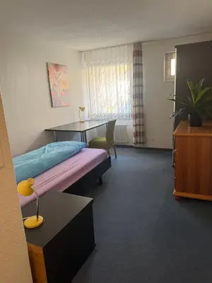 Ein Bett oder Betten in einem Zimmer der Unterkunft Hotel ilufa