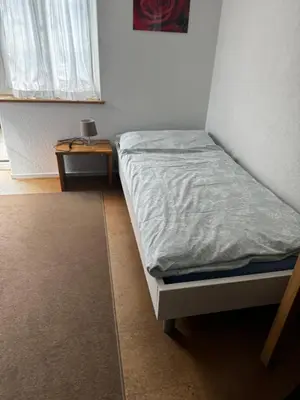 Ein Bett oder Betten in einem Zimmer der Unterkunft Small room