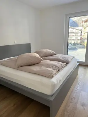 Ein Bett oder Betten in einem Zimmer der Unterkunft Apartment Strahlhorn by Interhome