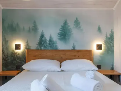 Ein Bett oder Betten in einem Zimmer der Unterkunft Chalet Le Boletus by Interhome