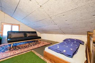 Ein Bett oder Betten in einem Zimmer der Unterkunft Ferienhaus Allalin