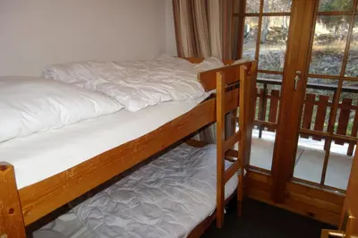 Ein Bett oder Betten in einem Zimmer der Unterkunft Mayens de l'Ours CZ 013 - MOUNTAIN apartment 8 per