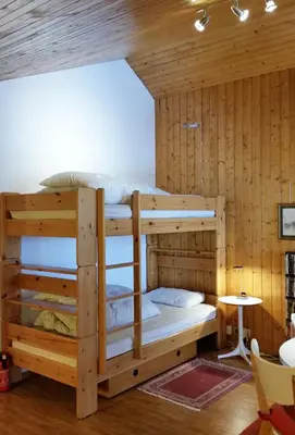 Ein Bett oder Betten in einem Zimmer der Unterkunft Ski-in Apartment in Anzere