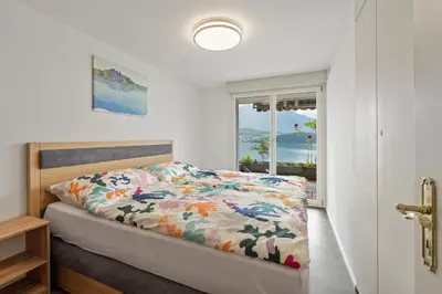 Ein Bett oder Betten in einem Zimmer der Unterkunft Juwel mit Traumsicht auf See und Berge!