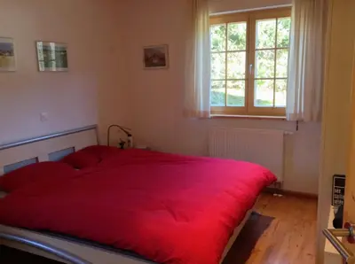 Ein Bett oder Betten in einem Zimmer der Unterkunft Gorgeous Chalet in Truttli Area of Lauenen
