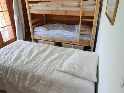 Ein Bett oder Betten in einem Zimmer der Unterkunft Chalet in Les Masses with ski storage