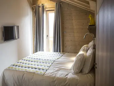 Ein Bett oder Betten in einem Zimmer der Unterkunft Chalet in Les Masses with garden