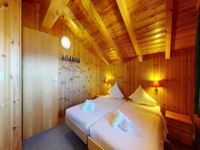 Ein Bett oder Betten in einem Zimmer der Unterkunft Chalet in Veysonnaz with swimming pool
