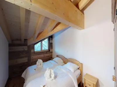 Ein Bett oder Betten in einem Zimmer der Unterkunft Duplex apartment in Veysonnaz