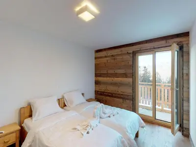 Ein Bett oder Betten in einem Zimmer der Unterkunft Duplex apartment in Veysonnaz