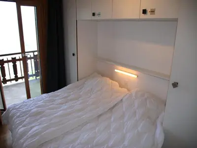 Ein Bett oder Betten in einem Zimmer der Unterkunft Mountain apartment with parking