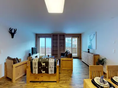 Ein Sitzbereich in der Unterkunft Pleasant apartment in Versonnaz