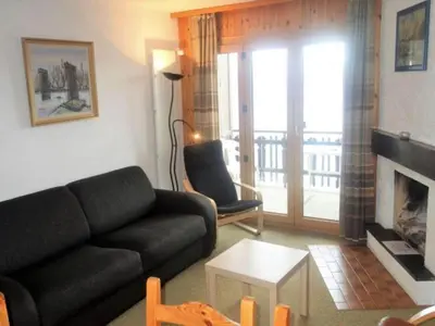 Ein Sitzbereich in der Unterkunft Pleasant apartment in Versonnaz