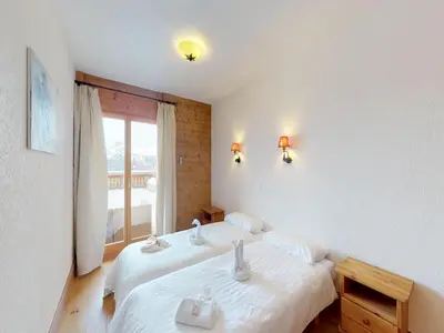 Ein Bett oder Betten in einem Zimmer der Unterkunft Modern apartment in Veysonnaz
