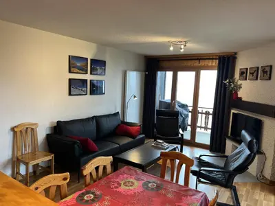 Ein Sitzbereich in der Unterkunft Valley-view apartment in Veysonnaz