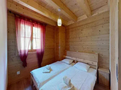Ein Bett oder Betten in einem Zimmer der Unterkunft Apartment on ski slopes of Prarion
